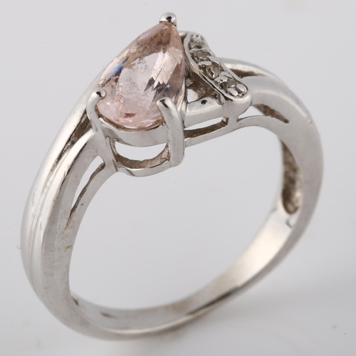 146 - A modern 9ct white gold pink stone and diamond dress ring, setting height 9mm, size K, 3.4g