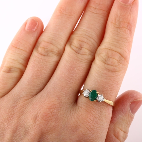 157 - An 18ct gold three stone emerald and diamond ring, set with oval mixed-cut emerald and modern round ... 