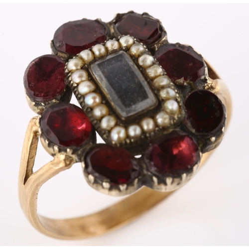 159 - A large Georgian garnet and pearl cluster memorial ring, unmarked gold closed-back settings with cen... 