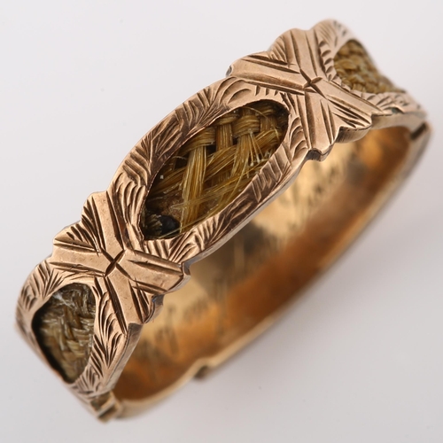 164 - A Victorian 9ct gold memorial band ring, with central engraved panel inscribed Mabel with woven hair... 