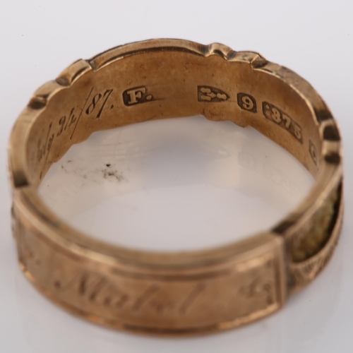 164 - A Victorian 9ct gold memorial band ring, with central engraved panel inscribed Mabel with woven hair... 