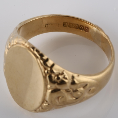 170 - A mid-20th century 9ct gold unascribed signet ring, relief embossed foliate shoulders, hallmarks Bir... 