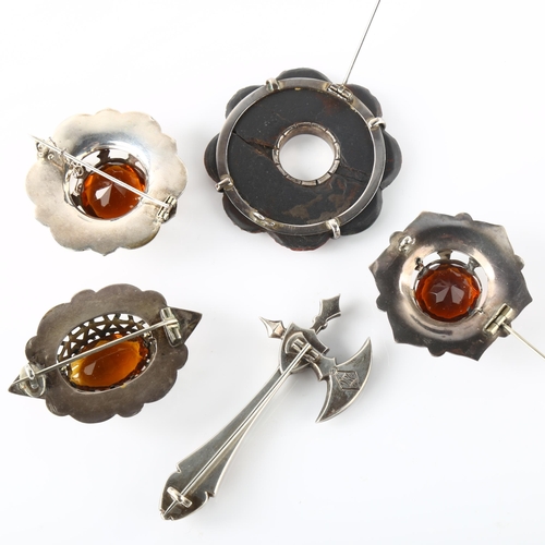 174 - A group of Scottish hardstone brooches, including axe example, unmarked silver settings, axe length ... 