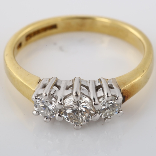 196 - An 18ct gold three stone diamond ring, set with modern round brilliant-cut diamond, total diamond co... 