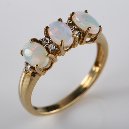 263 - A modern 9ct gold opal and cubic zirconia half hoop ring, set with oval cabochon opal and single-cut... 