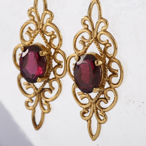 264 - A pair of 9ct gold garnet drop earrings, in Edwardian style with stud fittings, earring height 32.8m... 