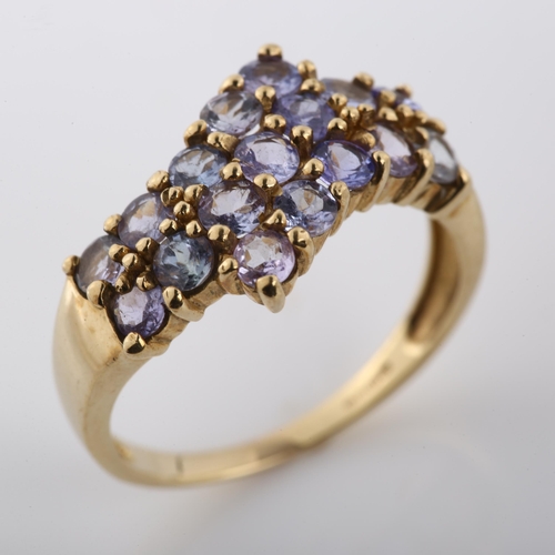 267 - A modern 9ct gold tanzanite crossover ring, setting height 11.7mm, size P, 2.8g