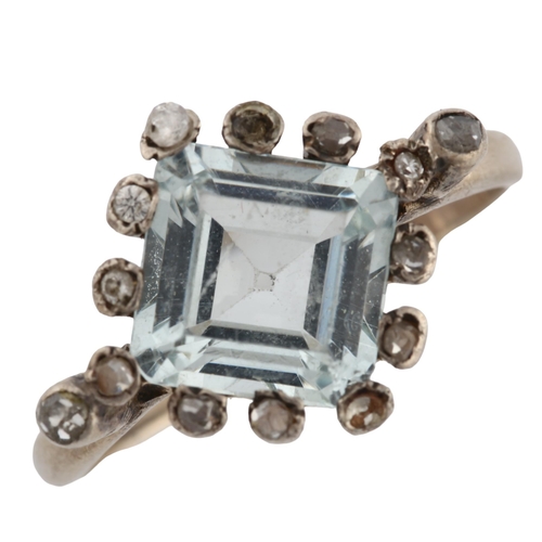 271 - An Art Deco style aquamarine and diamond cluster ring, unmarked white metal settings with square-cut... 