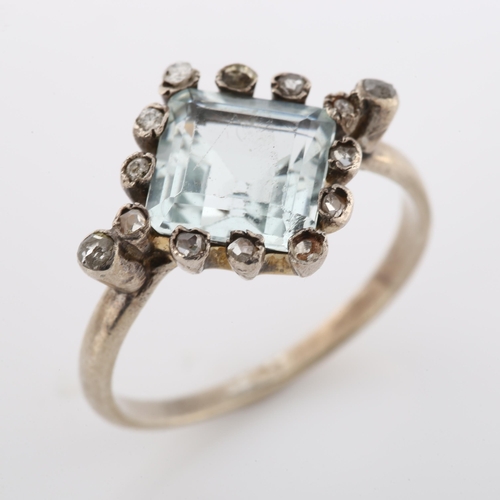 271 - An Art Deco style aquamarine and diamond cluster ring, unmarked white metal settings with square-cut... 