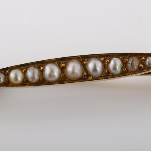 274 - A 19th century French pearl line brooch, unmarked high carat gold settings, brooch length 29.4mm, 1.... 