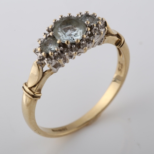 348 - A 9ct gold aquamarine and diamond cluster dress ring, setting height 8.8mm, size T, 3.1g