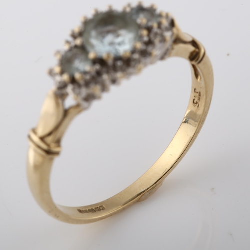 348 - A 9ct gold aquamarine and diamond cluster dress ring, setting height 8.8mm, size T, 3.1g