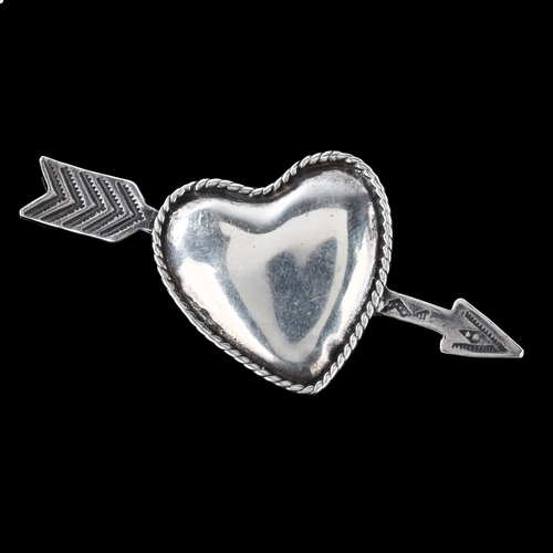 355 - FOREE HUNSICKER (1932 - 2015) - an American sterling silver heart and arrow pendant, signed, arrow l... 