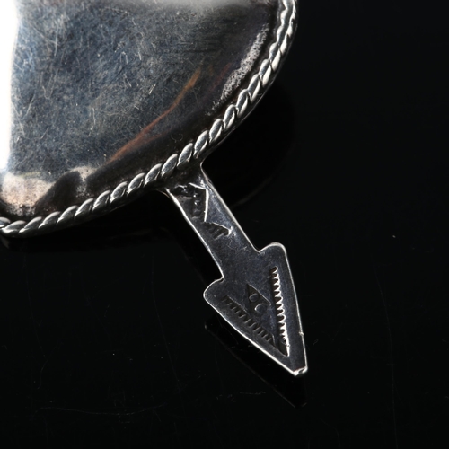 355 - FOREE HUNSICKER (1932 - 2015) - an American sterling silver heart and arrow pendant, signed, arrow l... 