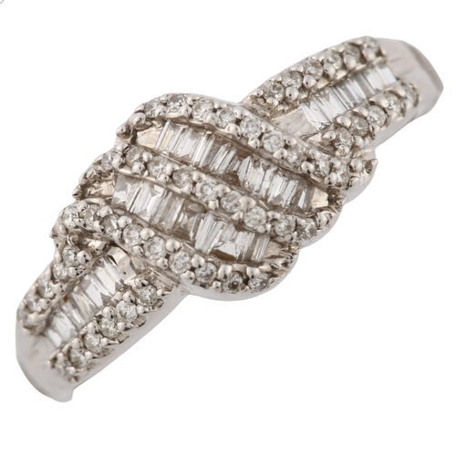 360 - A modern 18ct white gold diamond cluster crossover ring, set with tapered baguette and modern round ... 