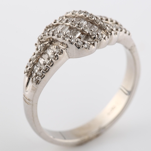 360 - A modern 18ct white gold diamond cluster crossover ring, set with tapered baguette and modern round ... 