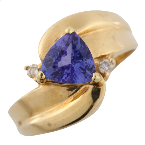 364 - A 14ct gold tanzanite and diamond crossover ring, set with trillion-cut tanzanite, setting height 11... 