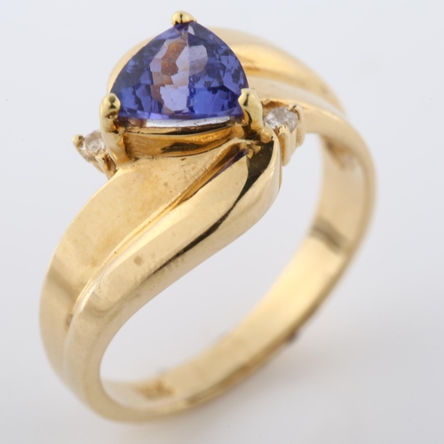 364 - A 14ct gold tanzanite and diamond crossover ring, set with trillion-cut tanzanite, setting height 11... 