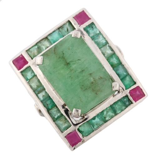 368 - A large emerald and ruby cluster cocktail ring, unmarked white metal settings with openwork bridge, ... 