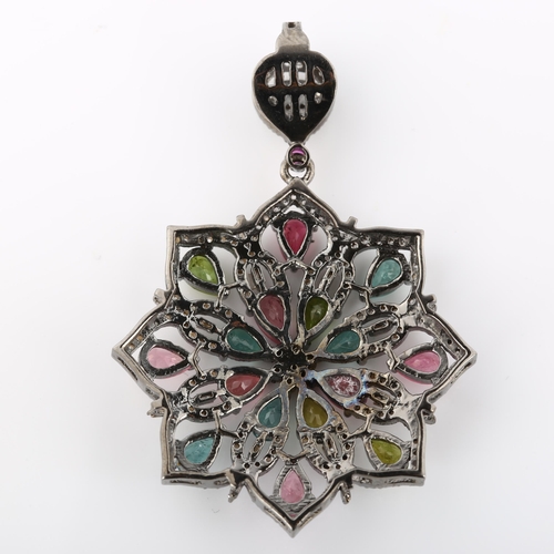 369 - A modern vari-hue tourmaline and diamond flowerhead pendant, set with pear-cut tourmalines and rose-... 