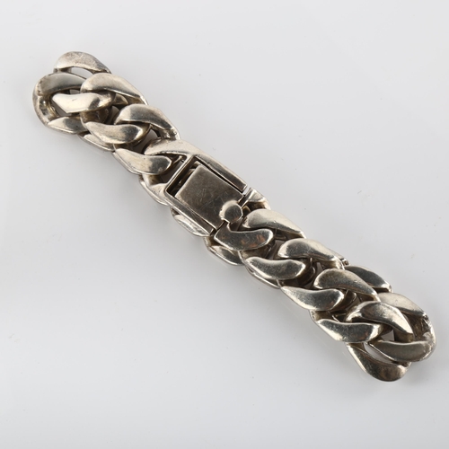 375 - A heavy silver flat curb link bracelet by Richard Fox, band width 14.7mm, bracelet length 22cm, 86g