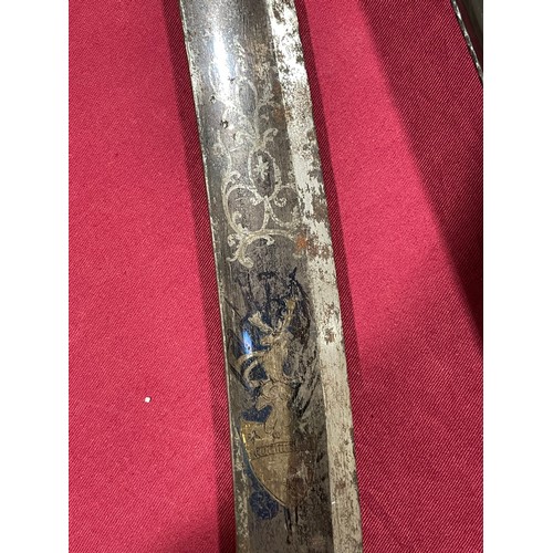 1223 - An early 19th Century cavalry sword with etched blade, length 87cm