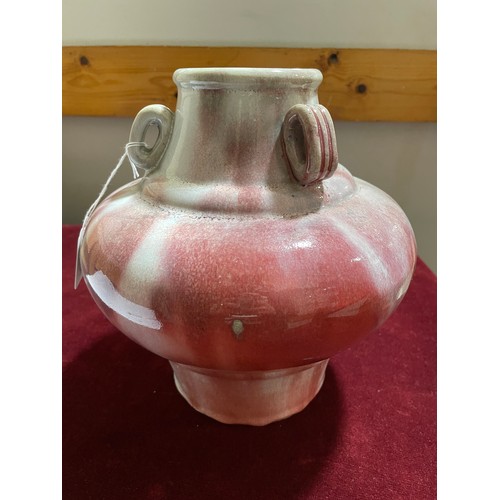 1197 - A Chinese red mottle glaze pot with neck rings, height 24cm