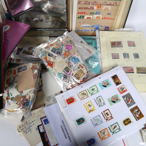 113 - A large quantity of world stamps, stamp reference books, loose stamps etc