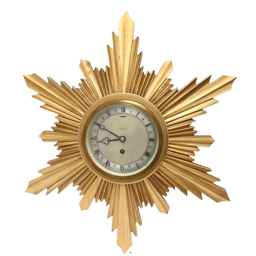 124 - A 1930s gilt starburst wall clock, by J W Benson, width 45cm