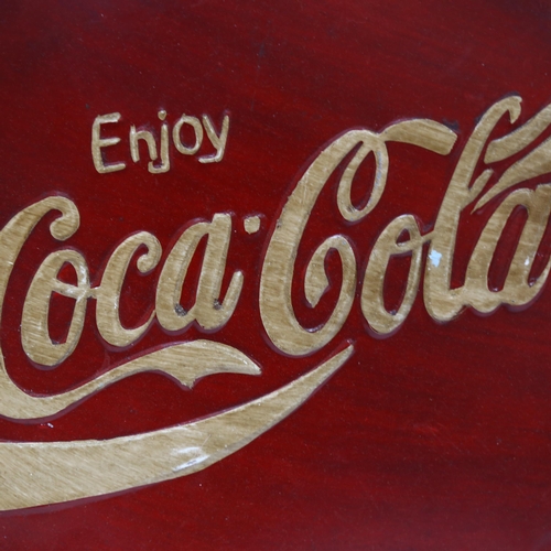 129 - A modern painted aluminium circular tray, embossed Coca Cola, diameter 53cm