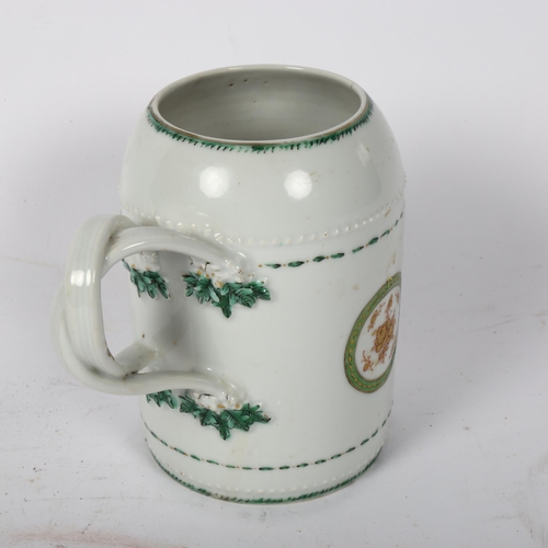 132 - An 18th century Chinese export porcelain tankard, double entwined handles, with hand painted gilded ... 