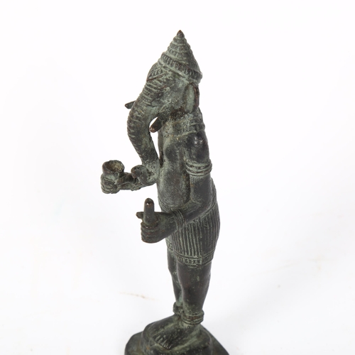 137 - A patinated bronze sculpture of Ganesh, height 15cm