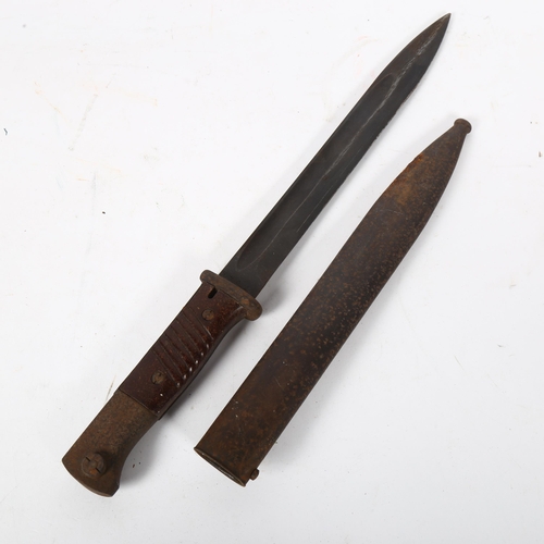 155 - A German military bayonet and scabbard, numbered 7045a and 44CQH, blade length 26cm, overall length ... 