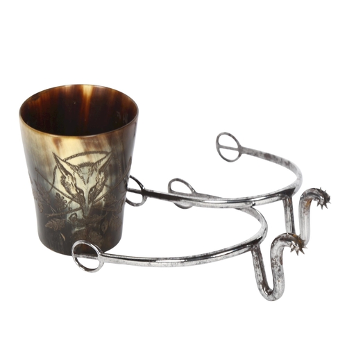 182 - A small horn beaker with engraved fox hunting scene, and a pair of Antique steel spurs