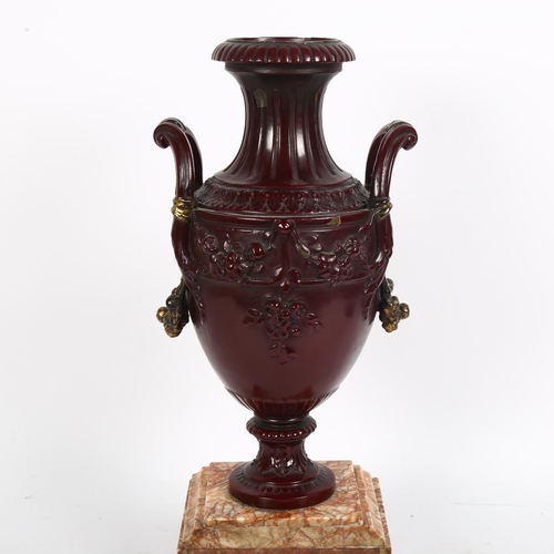 184 - Parcel-gilt patinated bronze urn on marble base with ormolu mounts, height 41cm