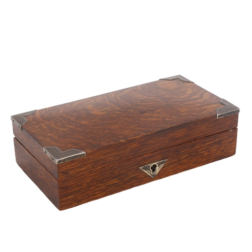 189 - A 1920s rectangular oak cigarette box, with silver mounts, length 23cm