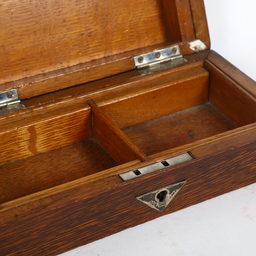 189 - A 1920s rectangular oak cigarette box, with silver mounts, length 23cm