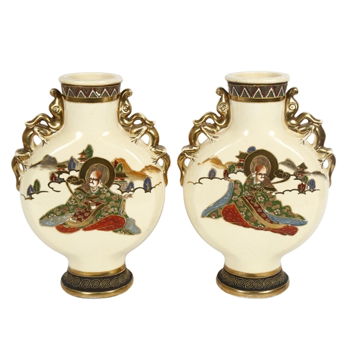 201 - A pair of Japanese cream ground moon flasks, with gilded dragon handles, height 32cm