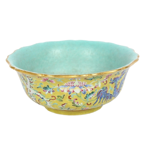 204 - A Chinese famille rose bowl, with flared lobed rim, on turned foot, with mystical beast design, diam... 