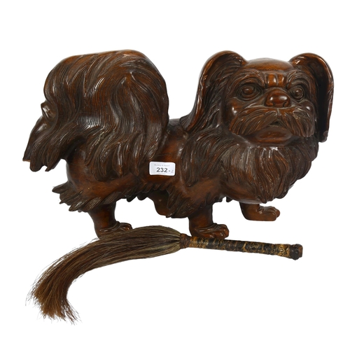 232 - A large carved wood study of a Pekingese dog, length 45cm, and a Vintage fly wisp