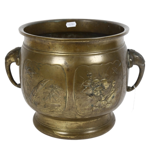 236 - A large Indian brass jardiniere, with elephant design handles and embossed panels, diameter 30cm ove... 