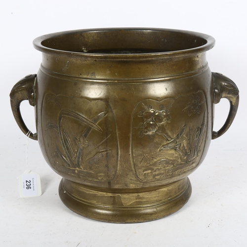 236 - A large Indian brass jardiniere, with elephant design handles and embossed panels, diameter 30cm ove... 