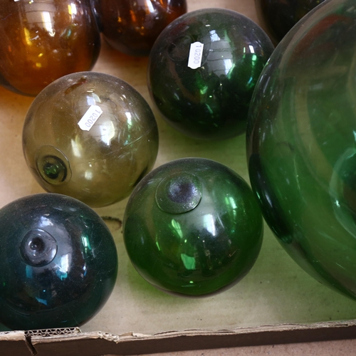 244 - A group of coloured glass balls and fishing floats, largest diameter 27cm (9)