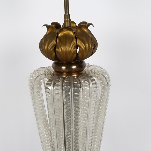 49 - A Vintage brass table lamp, with shaped moulded glass ribbed body and acanthus leaf collar, height t... 