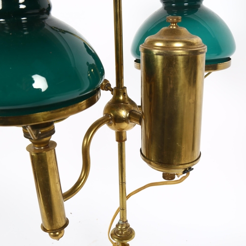 55 - A brass double student's desk lamp, adjustable height with green glass shades, handle height 56cm