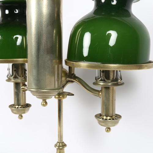 57 - MILLER & SONS PICADILLY - a polished brass double adjustable student's oil lamp, with green glass sh... 