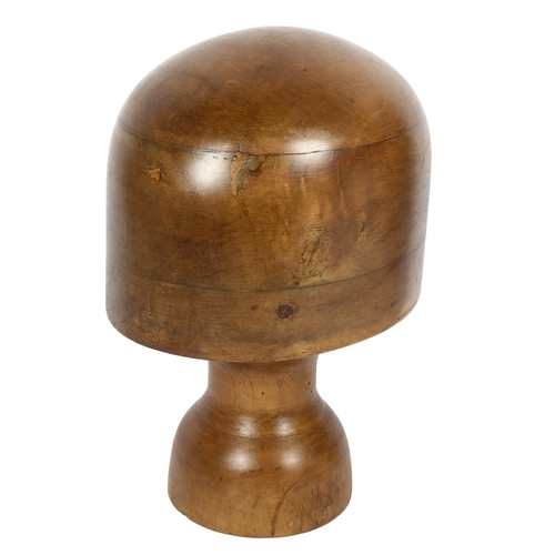 69 - A milliner's turned wood hat block on stand, height 27cm