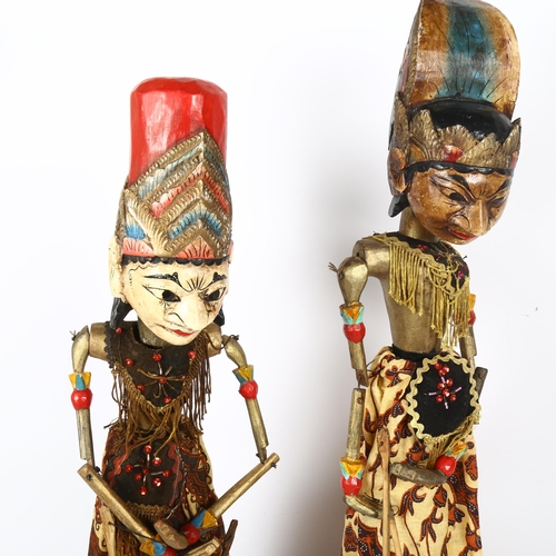 71 - 2 Thai Balinese puppets on stand, tallest 75cm