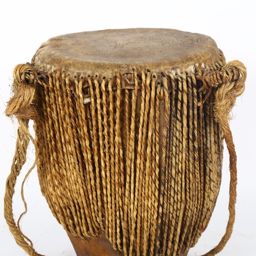 73 - An African skin drum, height 32cm