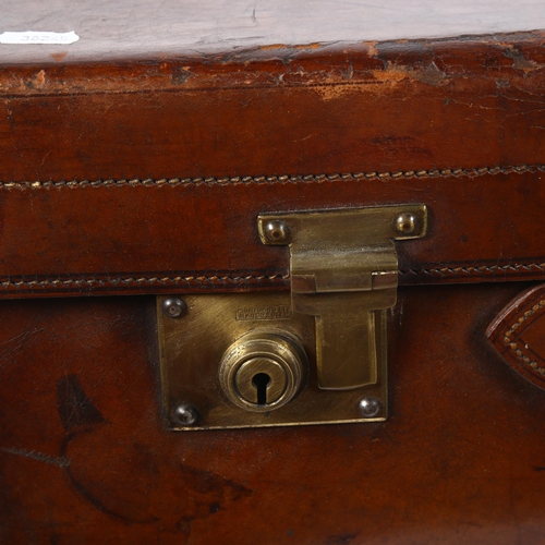 93 - FINNIGANS LTD - a Victorian leather suitcase, with tooled green leather interior, both brass plate l... 